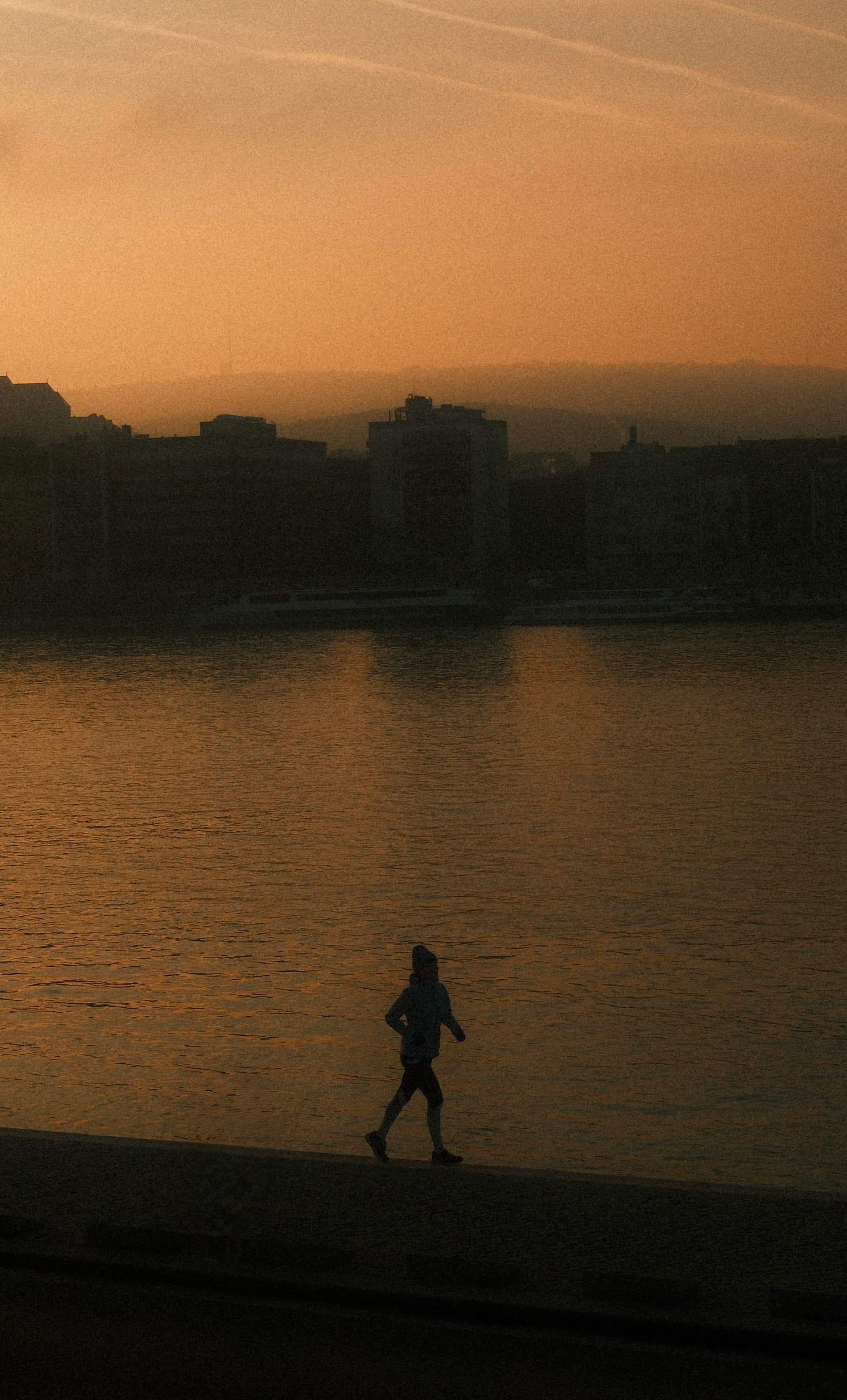 Runner along the Danube at sunset, Budapest